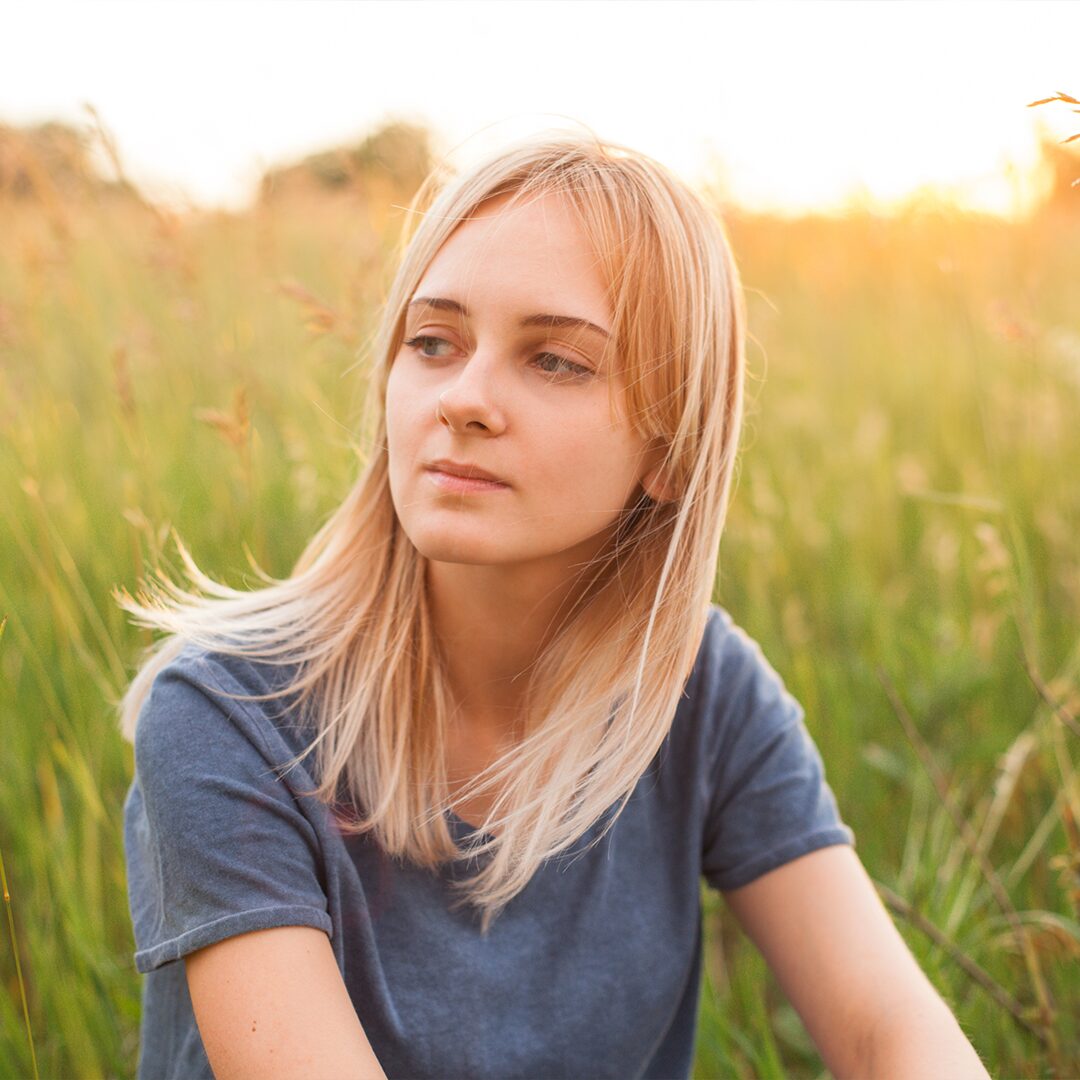 a girl thinking about who will adopt her baby